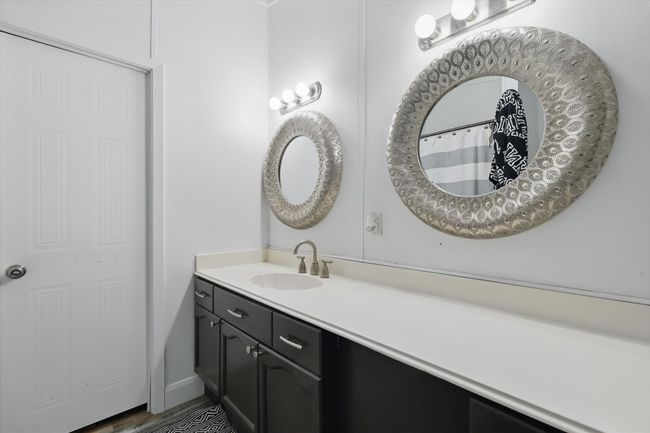 Full bath featuring wood finished floors and vanity | Image 13
