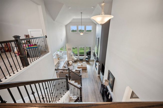 Stairway featuring high vaulted ceiling, wood finished floors, ceiling fan, and recessed lighting | Image 29