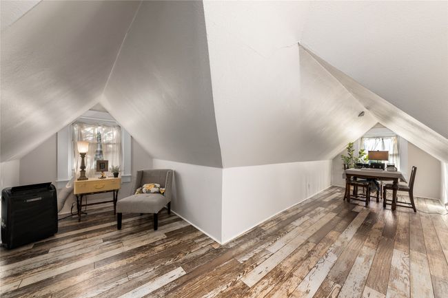 Additional living space with wood-type flooring and lofted ceiling | Image 21