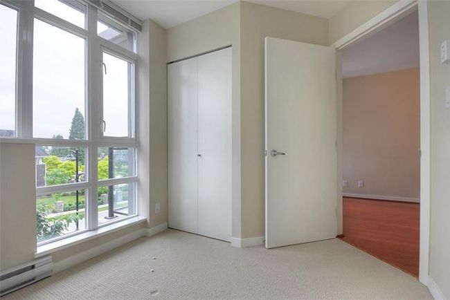 Unfurnished bedroom featuring baseboards, carpet floors, a closet, and a baseboard radiator | Image 18