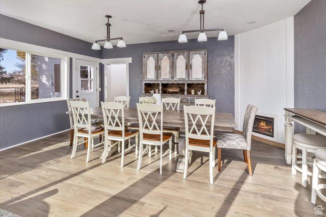 Dining space featuring light hardwood / wood-style flooring and track lighting | Image 13