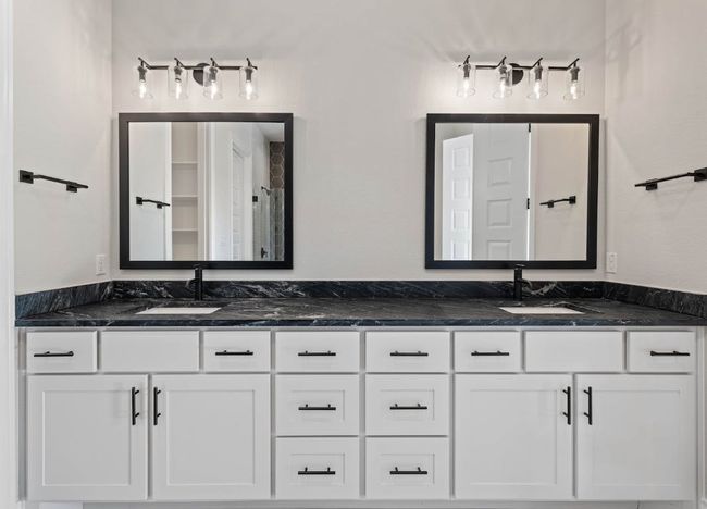 Bathroom featuring double vanity and a sink | Image 19