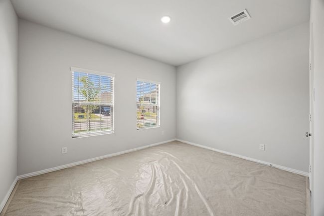 Empty room featuring light carpet and recessed lighting | Image 11