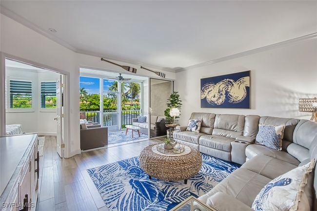 Living area with light wood-type flooring | Image 19