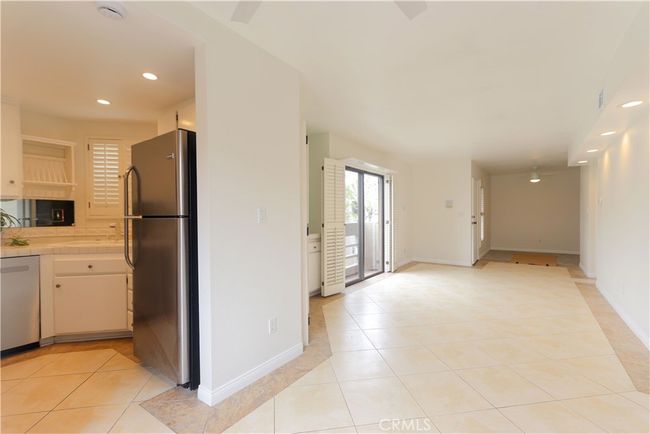living room with den or office | Image 5