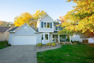 View of front property featuring a garage and a front lawn | Image 1