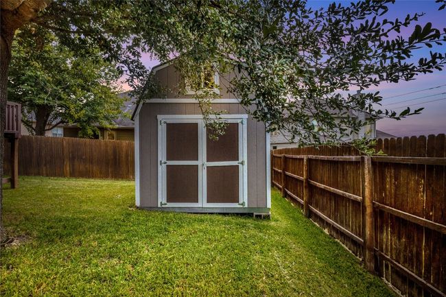 Wooden deck featuring a fenced backyard, area for grilling, and outdoor lounge area | Image 18