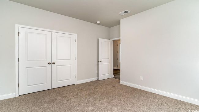 Unfurnished bedroom featuring a closet and carpet floors | Image 8