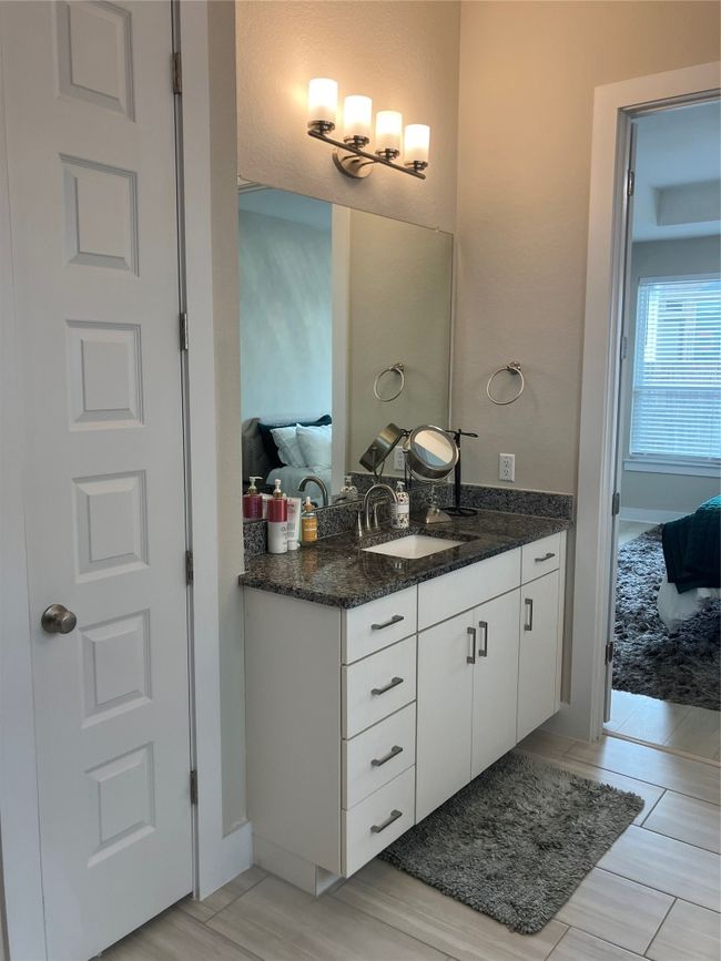Bathroom featuring vanity and ensuite bath | Image 11