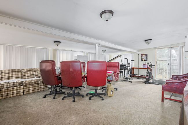 Spacious Sunroom, Carpet Flooring, Many Windows | Image 15