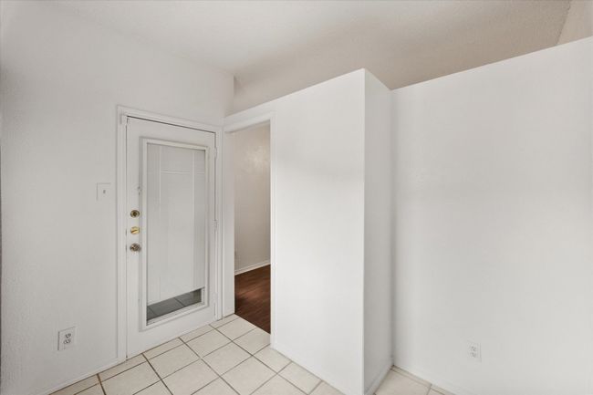 Spare room with light tile patterned floors | Image 11
