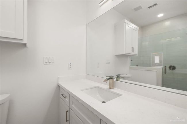 Full bath featuring vanity, a stall shower, and recessed lighting | Image 12