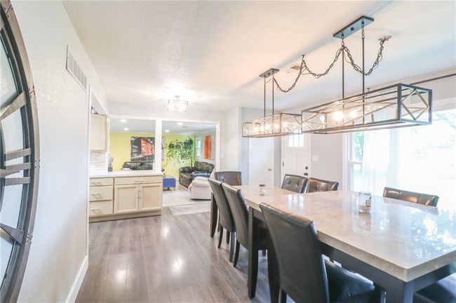 Dining area featuring wood finished floors | Image 8