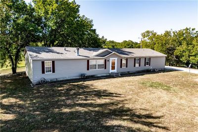 Ranch-style house featuring a front lawn | Image 1