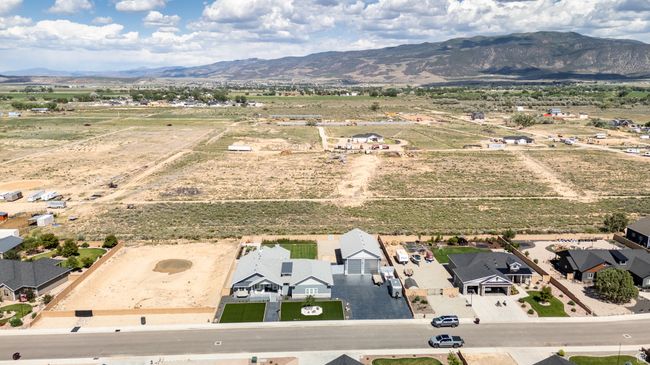 Aerial view of sparsely populated area with mountains | Image 122