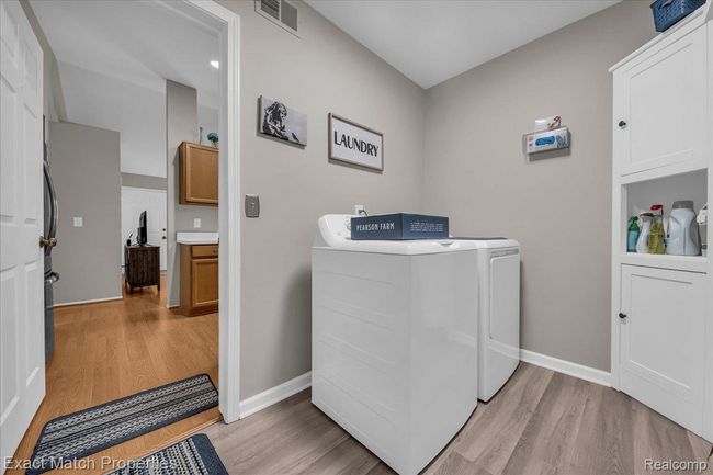 First floor laundry room with updated flooring | Image 23