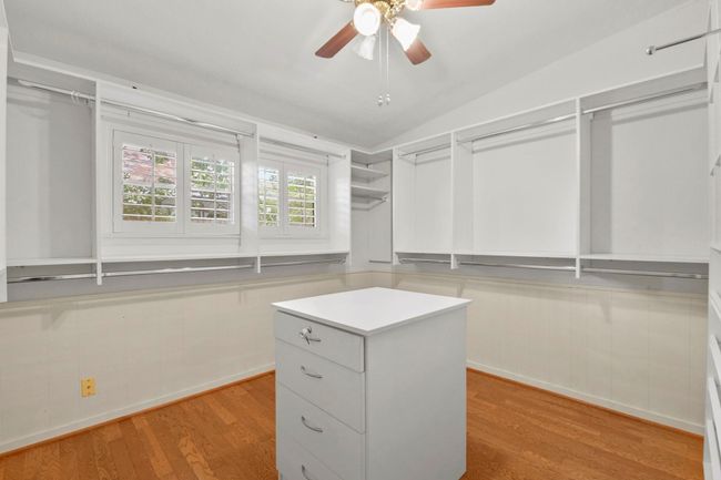 This expansive closet, originally the third bedroom, features floor-to-ceiling racks and custom built-ins for ultimate organization. | Image 24