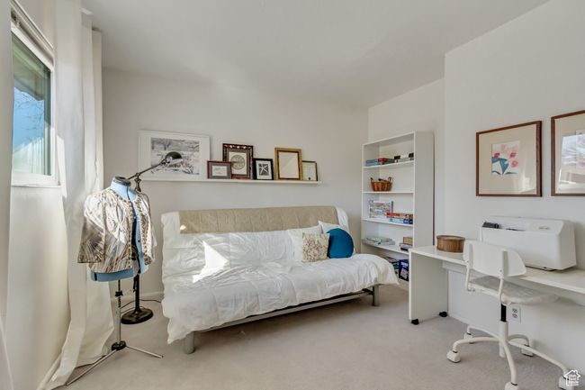 Carpeted bedroom featuring baseboards | Image 22
