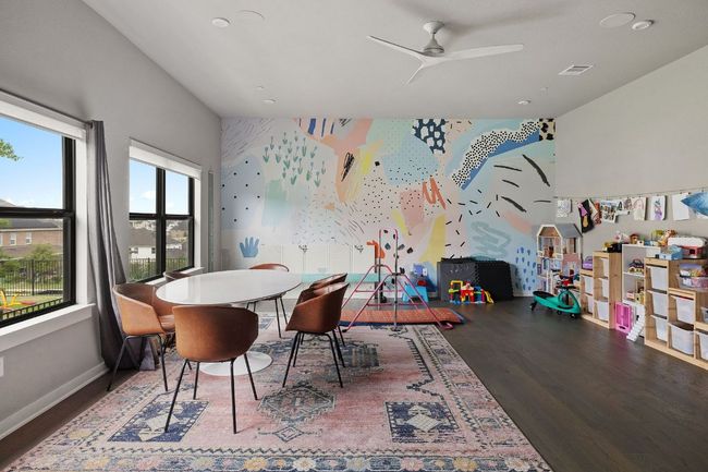 Dining space with visible vents, baseboards, a ceiling fan, wood finished floors, and wallpapered walls | Image 28