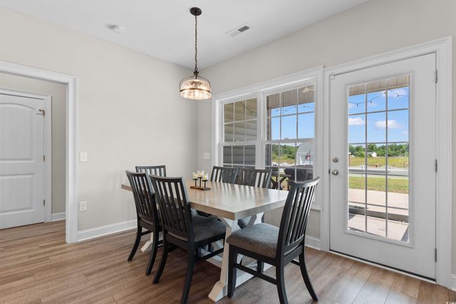 Dining room featuring light wood-style floors and baseboards | Image 13