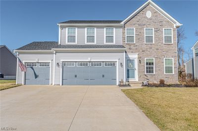 View of front of property with a front lawn and a garage | Image 1