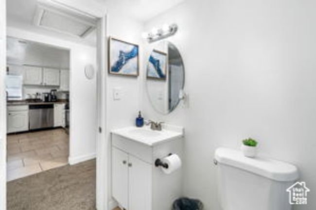 Half bath with vanity, toilet, and tile patterned flooring | Image 24