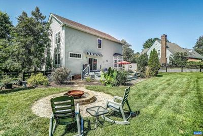 Expansive back yard features fire pit and plenty of room to run! | Image 2