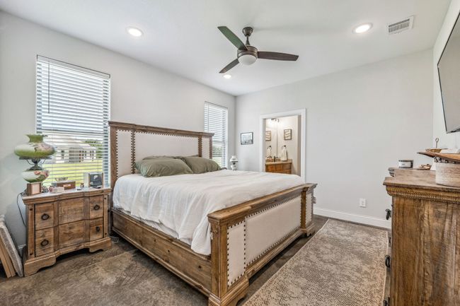 Bedroom featuring recessed lighting, baseboards, ceiling fan, and ensuite bathroom | Image 11
