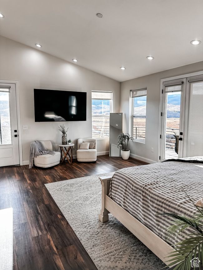 Bedroom with access to exterior, lofted ceiling, wood finished floors, and recessed lighting | Image 16