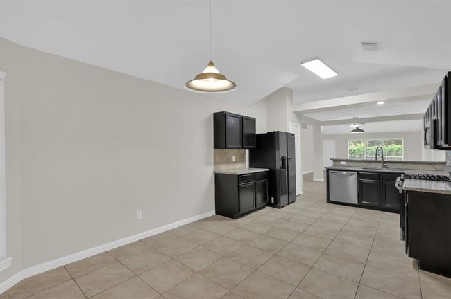 Kitchen with Refrigerator included. | Image 22