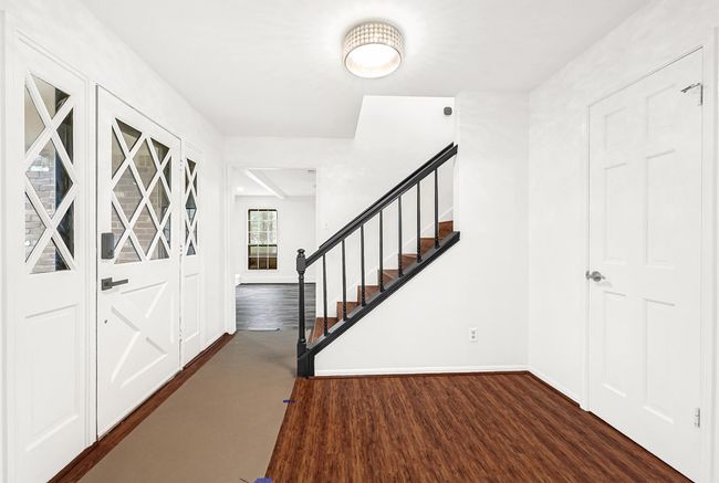 Front entry way with formal living off to the left and a large flex room to the right. | Image 6