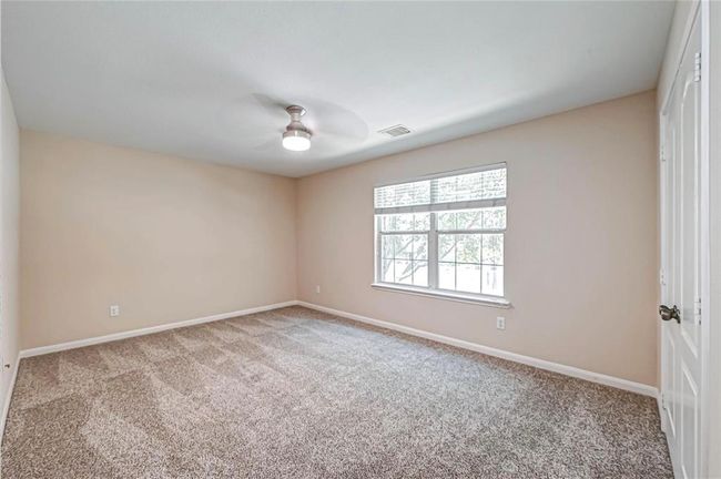 The two secondary bedrooms offers recent carpet, a large window and closet. | Image 31