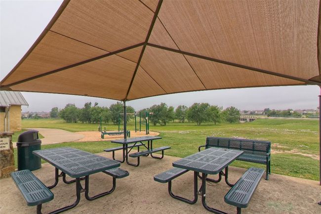 View of community featuring a lawn | Image 35