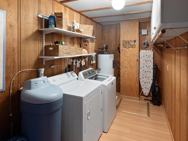 Spacious 13x6 laundry room on the main level. Crawl space access is visible in the photo—seller has upgraded it with spray foam insulation, poly, and a dehumidifier. | Image 34