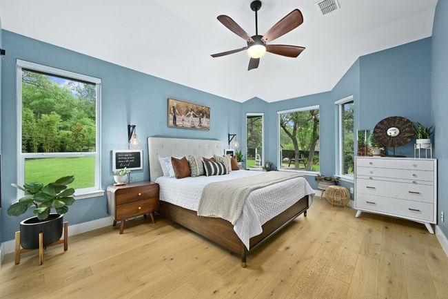 Primary bedroom with two walls of windows. | Image 13