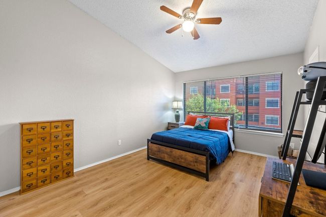The primary bedroom features an oversized window. | Image 14