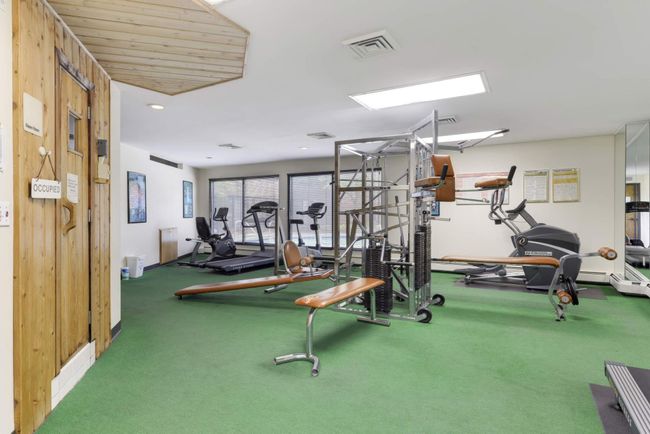 Exercise room with adjacent sauna access for post-workout relaxation | Image 33