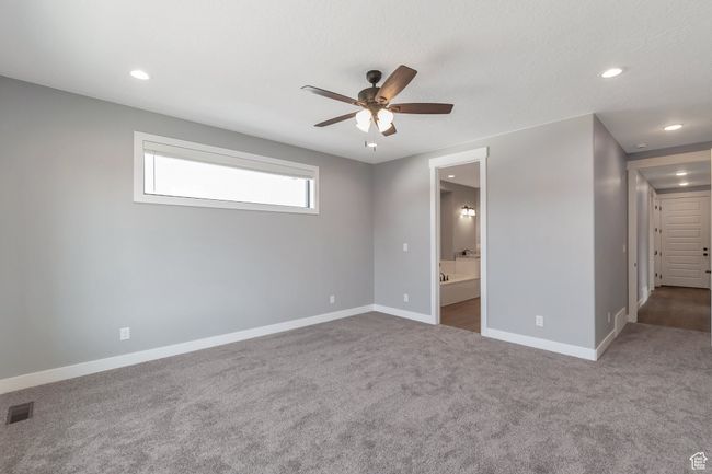 Spare room featuring ceiling fan, recessed lighting, and carpet | Image 18