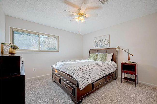 Secondary bedroom offers a welcoming and functional space. | Image 22