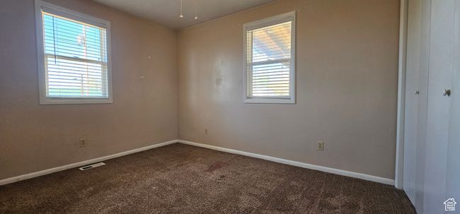 Carpeted empty room featuring a healthy amount of sunlight | Image 33