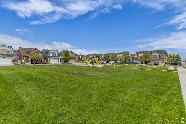 View of yard with playground community and a residential view | Image 30