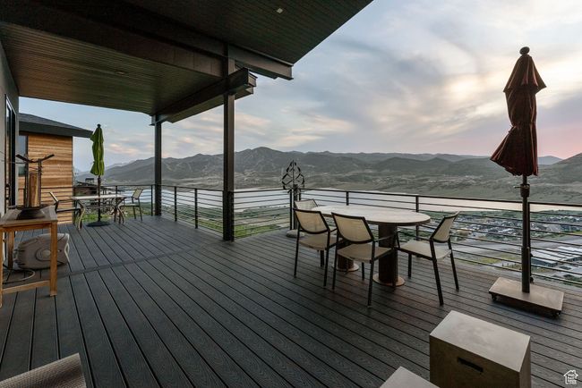Wooden deck with outdoor dining space and a mountain view | Image 86