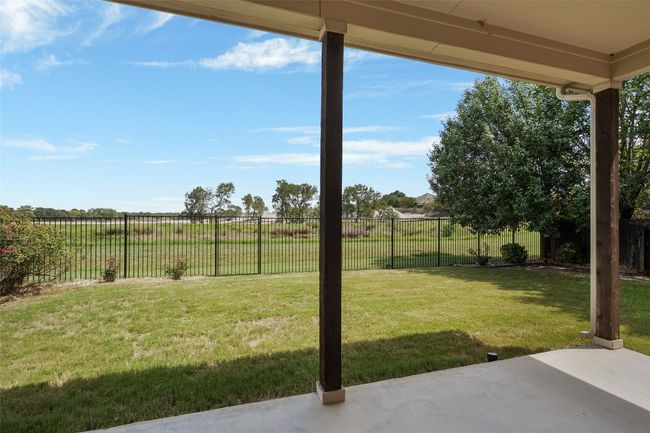 Fenced backyard featuring a patio | Image 36