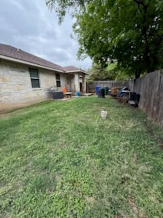 View of yard featuring a fenced backyard | Image 11