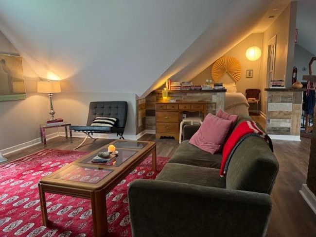 Living area featuring vaulted ceiling and wood finished floors | Image 27