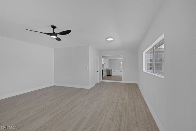 Unfurnished living room featuring light wood-style floors and ceiling fan | Image 20
