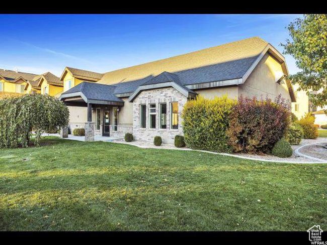 View of front of house with stone siding and a front yard | Image 13