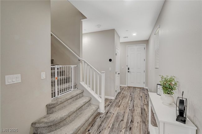 Foyer entrance with stairs, light wood finished floors, baseboards, and recessed lighting | Image 27