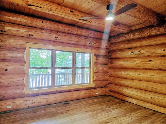 Log home main floor bedroom.jpg | Image 15
