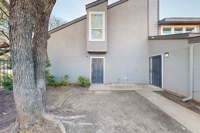 Back of property featuring stucco siding and a patio | Image 5